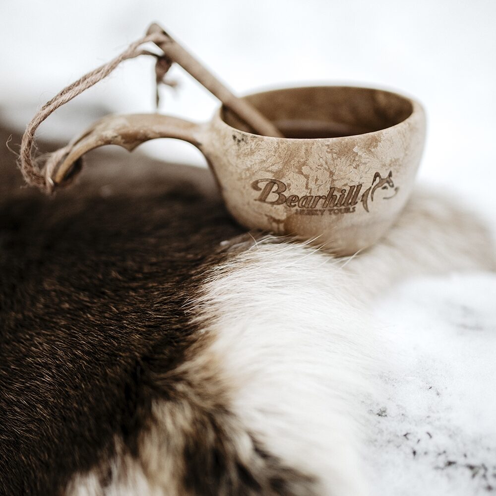 Traditional Finnish kuksa/cup on reindeer pelt with Bearhill Husky logo
