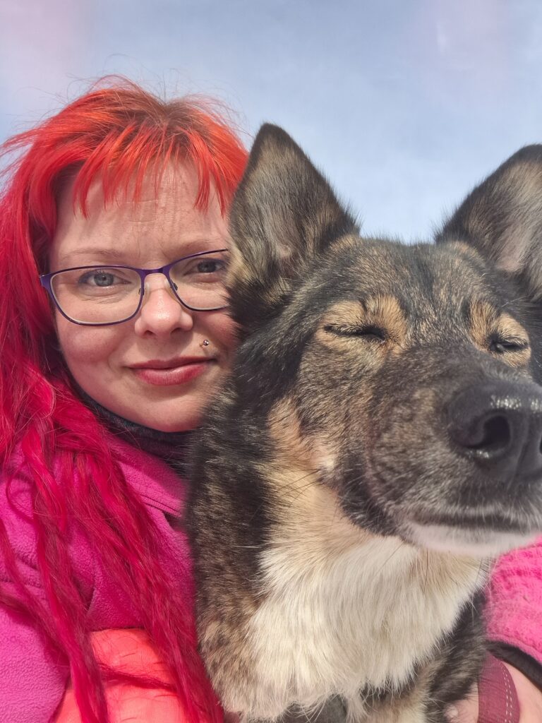 Jessica and one of her huskies cuddling
