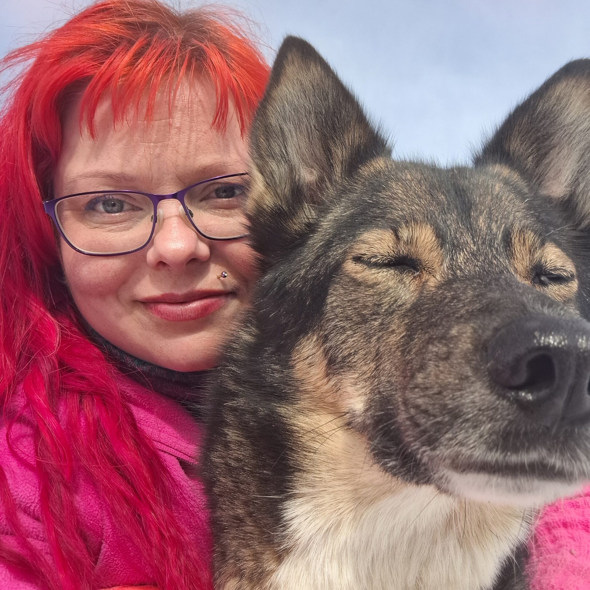Jessica and one of her huskies cuddling